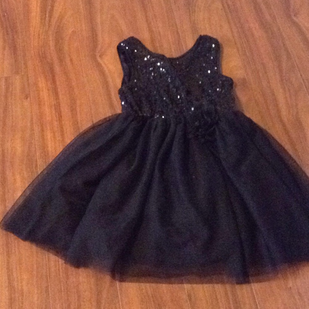 Cute black dress with sequins and a bow